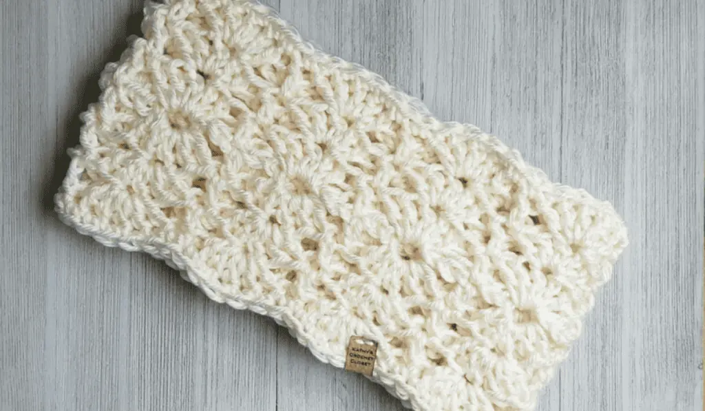 A white crochet infinity scarf.