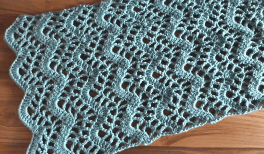 A blue crochet table runner