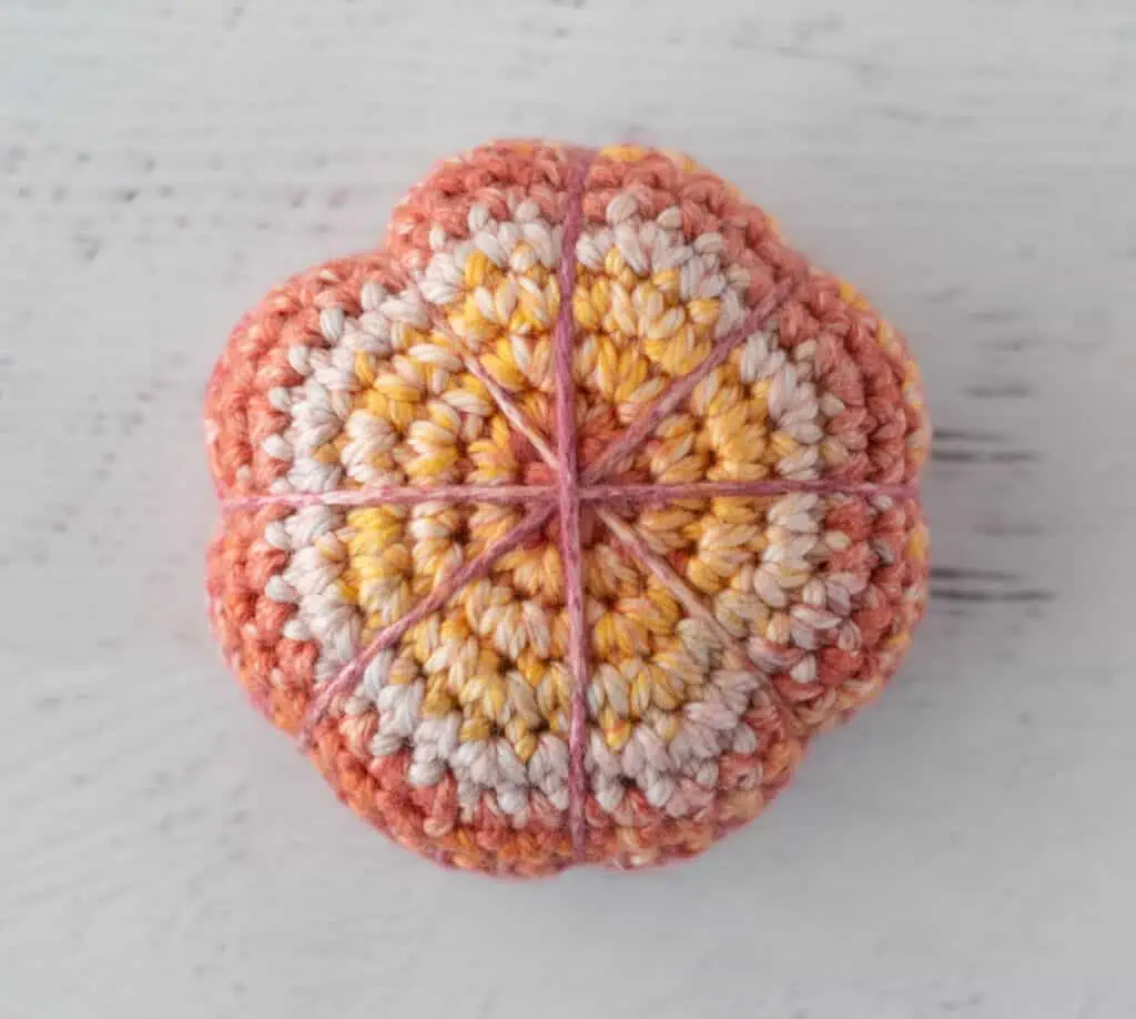 Cinched crochet sphere forming a pumpkin shape