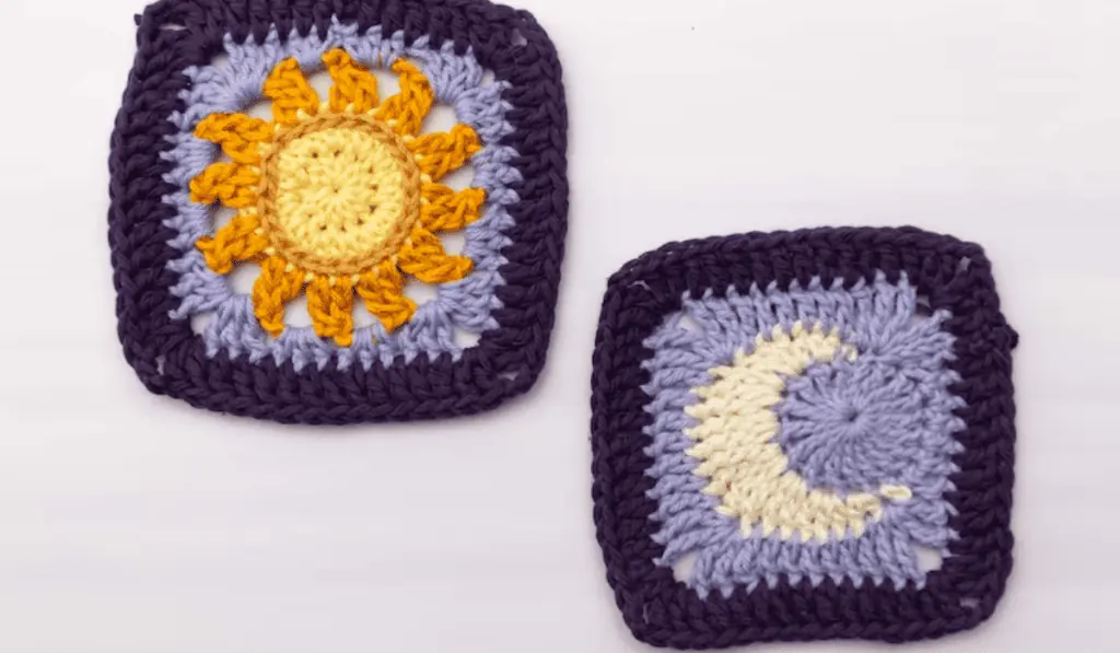 Two granny squares with blue backgrounds, one is a sun and one is a moon.