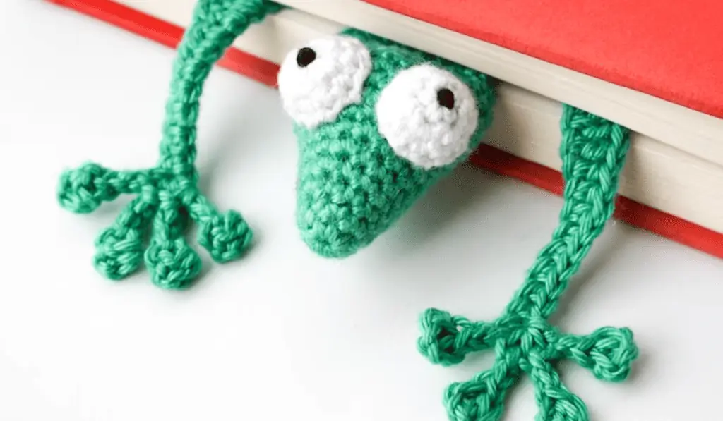 A crochet gecko bookmark.