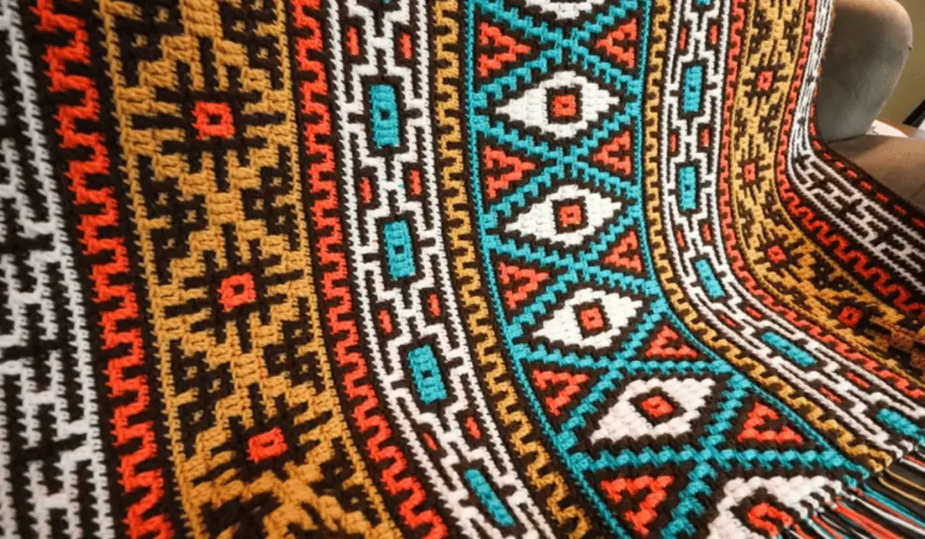 A bohemian-looking mosaic crochet blanket pattern.