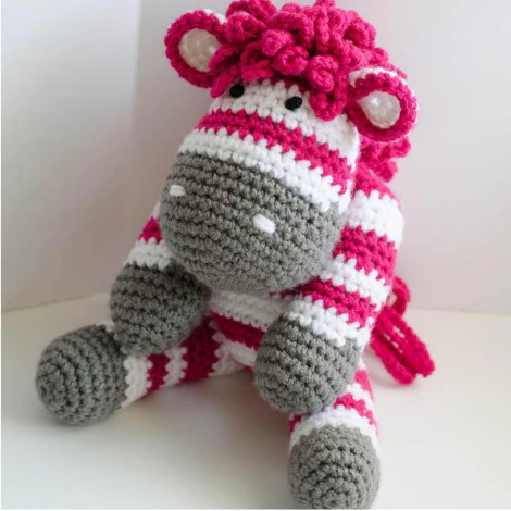 pink, white and gray crochet zebra