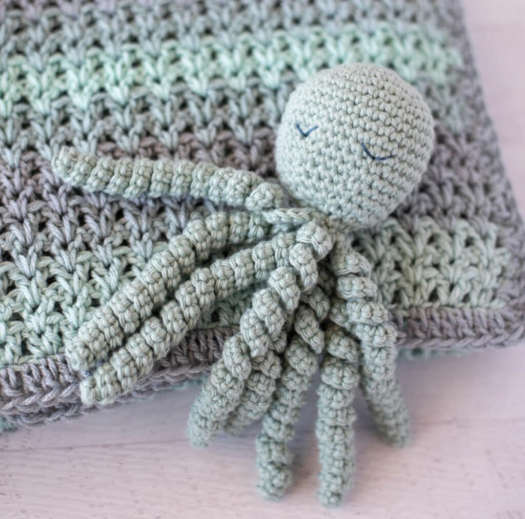 Blue Gray color crochet octopus with embroidered sleeping eyes