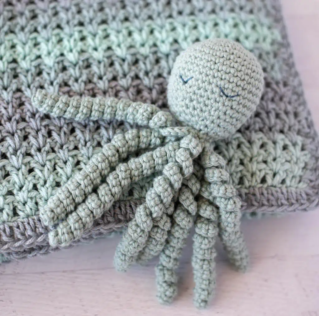 Blue Gray color crochet octopus with embroidered sleeping eyes