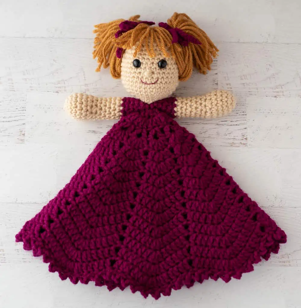 Folded princess lovey doll in pink dress and blonde hair