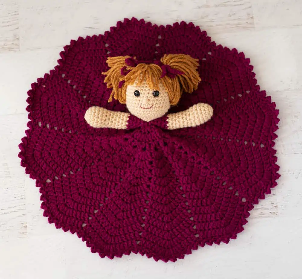 Open crochet lovey doll with pink dress