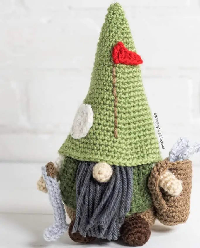 Crochet gnome with green hat and golf bag