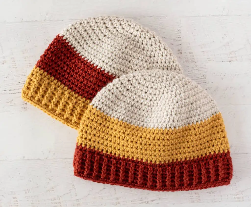 Crochet candy corn hats in cream, rust and yellow yarn