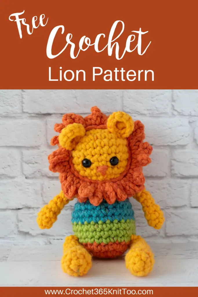 Pin of yellow and orange rochet lion with a rainbow striped body