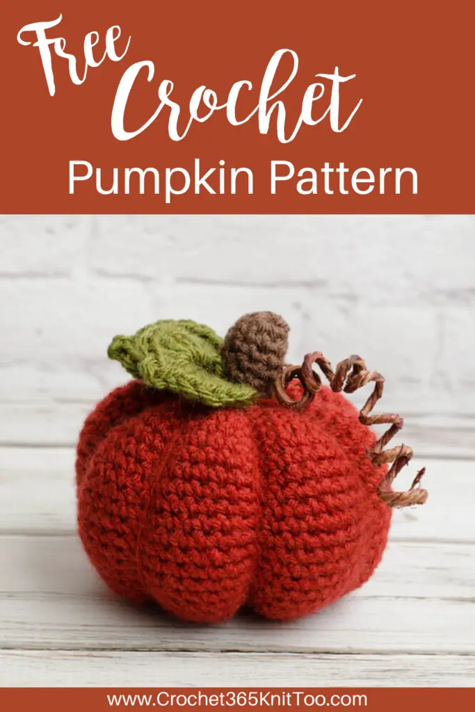 Image of crochet pumpkin in orange with brown stem and green leaves