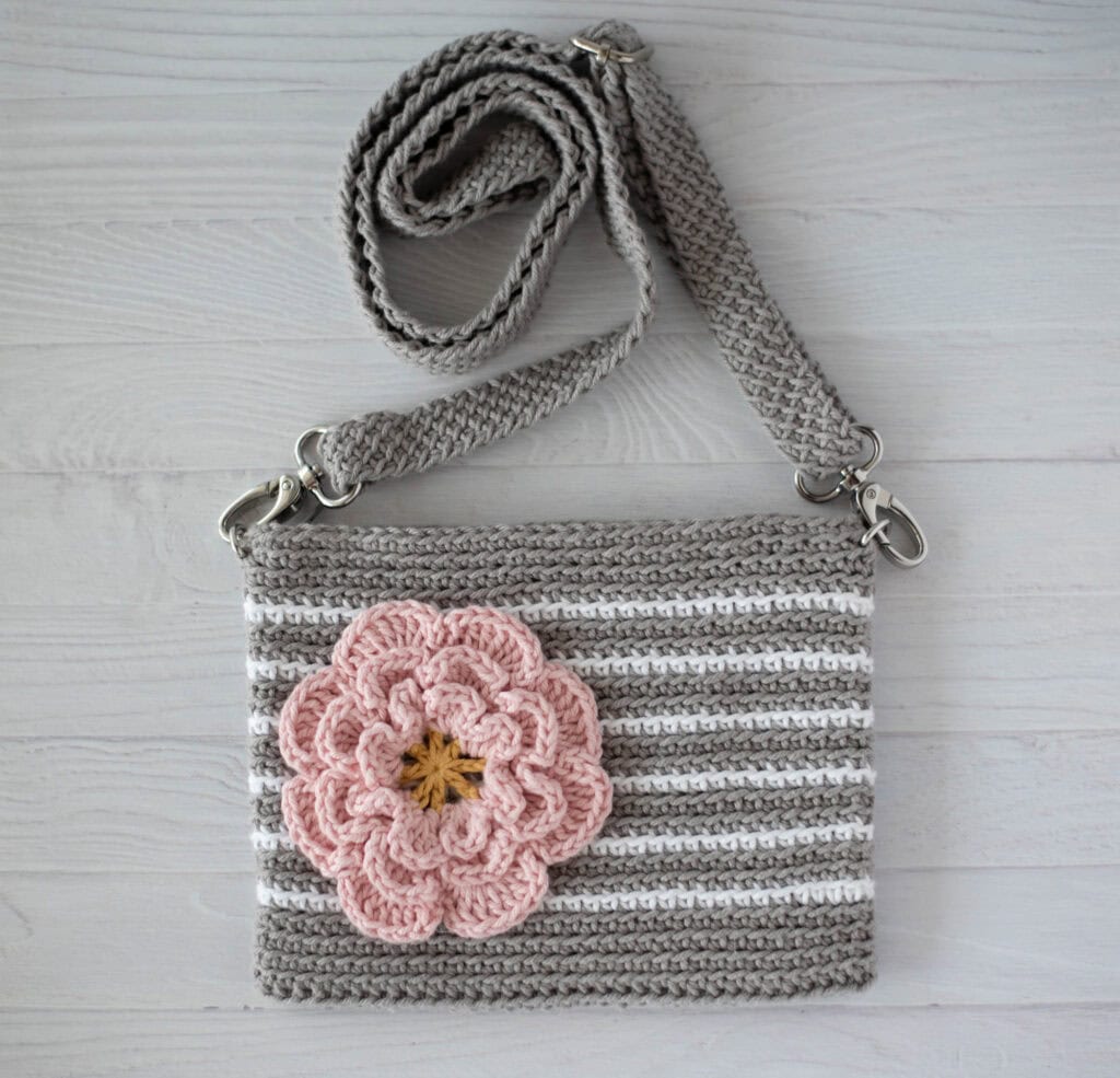 Gray crochet bag with white stripes and pink flower
