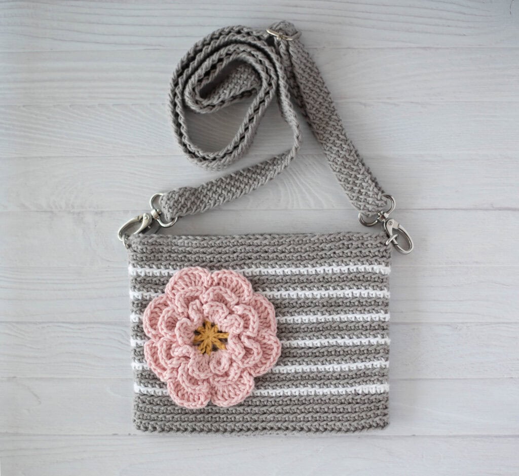 Gray crochet bag with white stripes and pink flower
