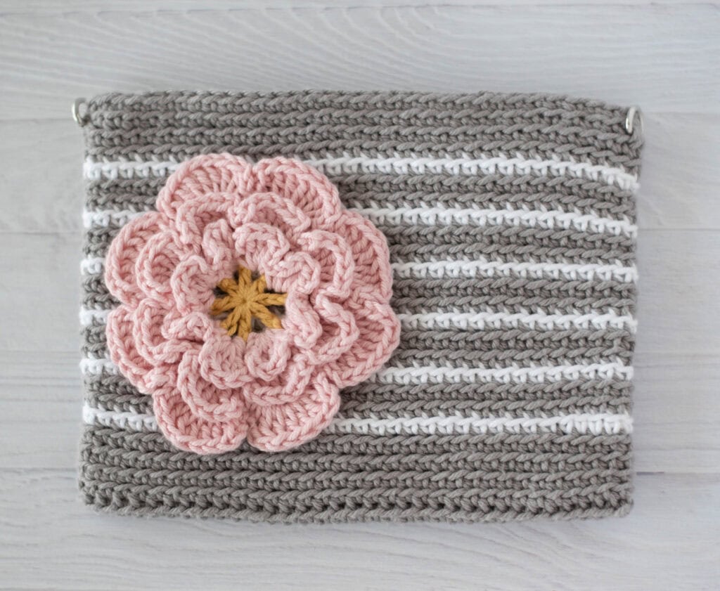 Gray crochet bag with white stripes and pink flower
