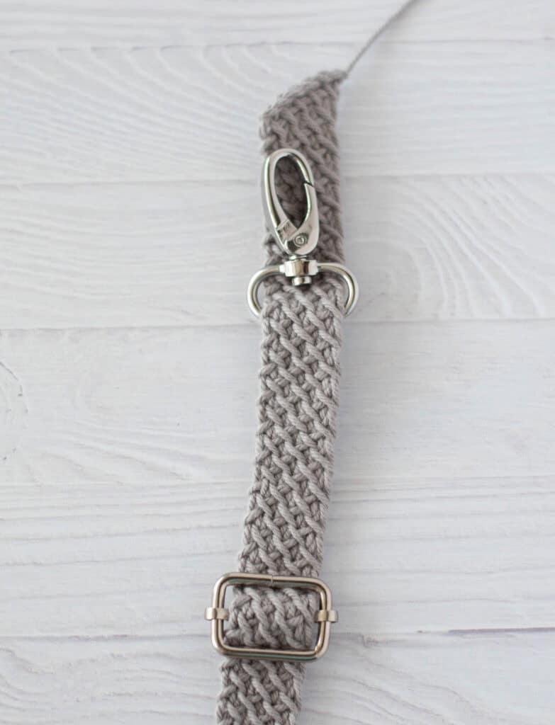 Gray crochet strap with metal hardware