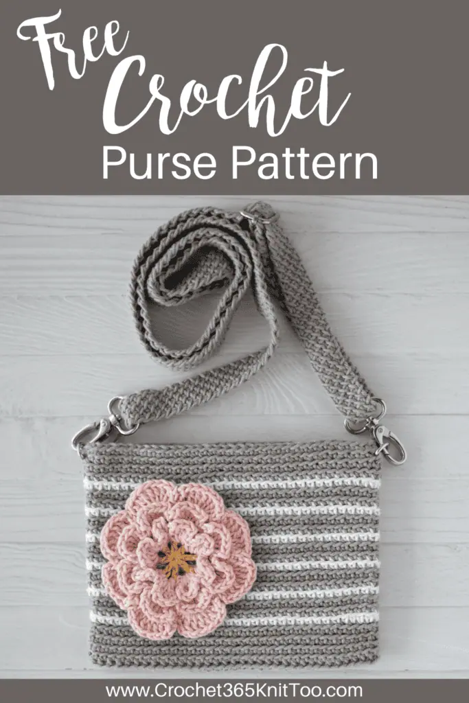 Pin image of a gray and white striped crochet bag with a pink flower