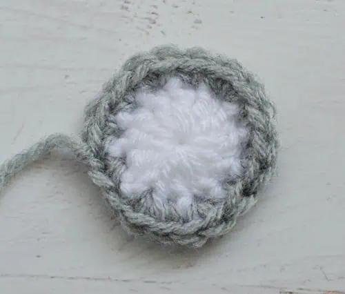 white crochet circle with gray border