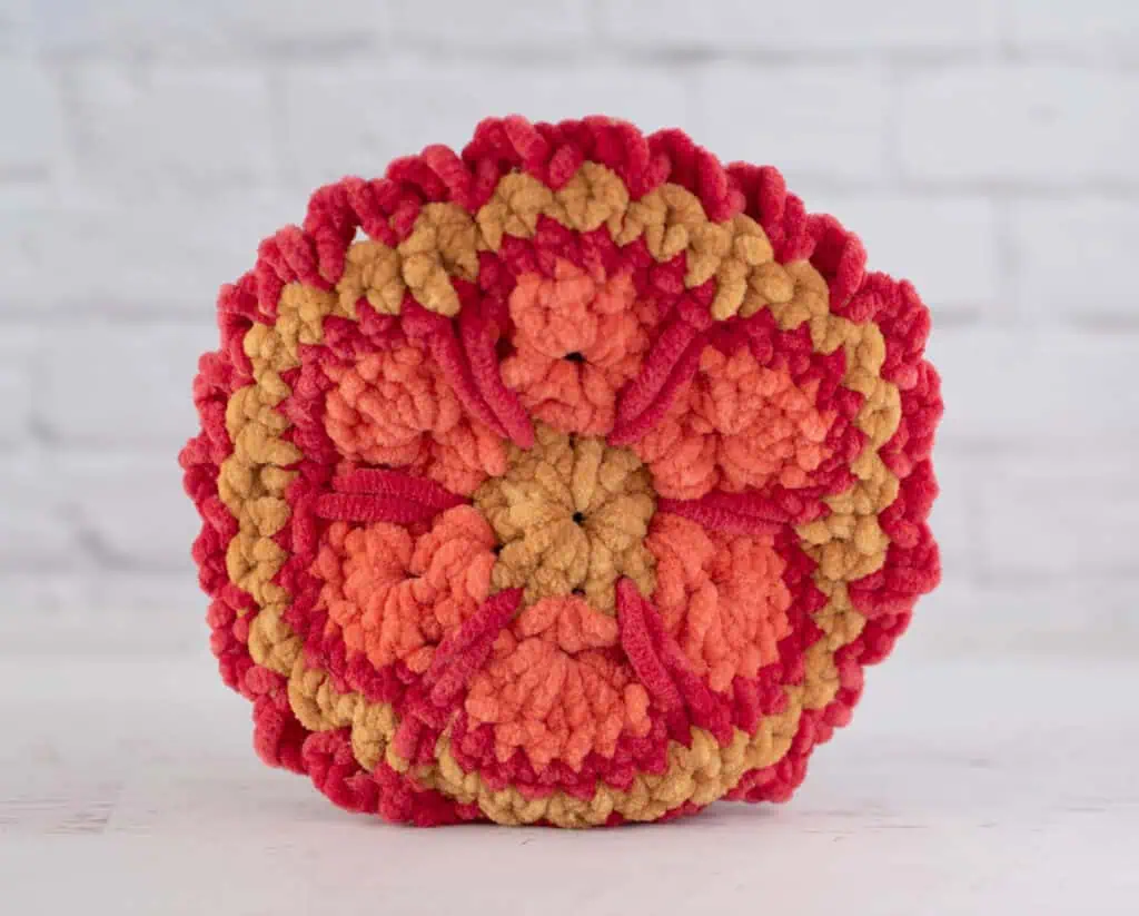 Back feathers of crochet turkey in red, orange and gold