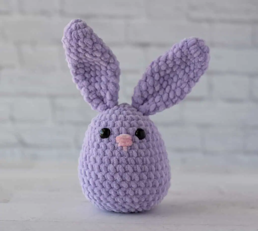 Purple crochet plush bunny with pink nose