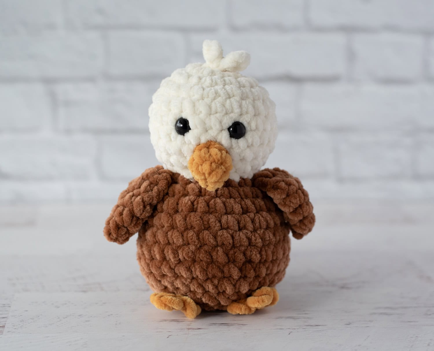 Crochet eagle in cream, brown and gold plush yarn