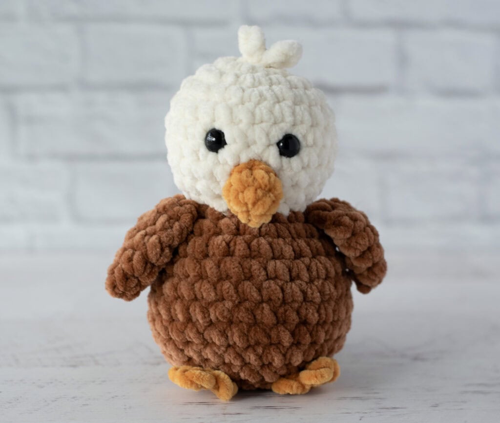 Crochet eagle in cream, brown and gold plush yarn