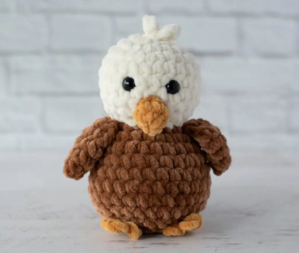Crochet eagle in cream, brown and gold plush yarn