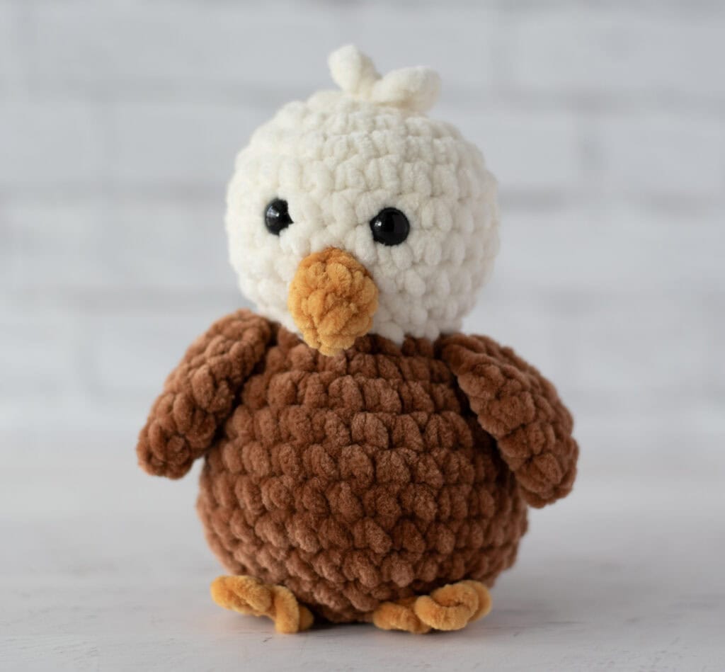 Crochet eagle in cream, brown and gold plush yarn