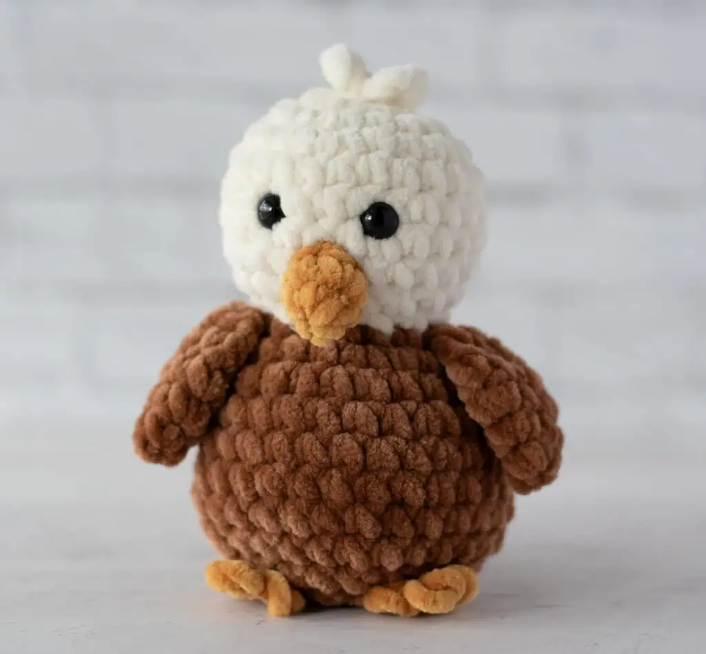 Crochet eagle in cream, brown and gold plush yarn