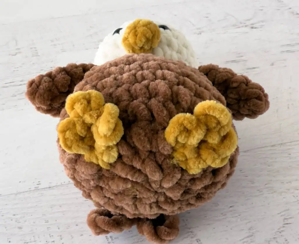 Crochet eagle feet in cream, brown and gold plush yarn