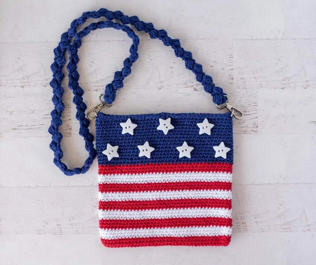 A crocheted purse with stars and stripes.