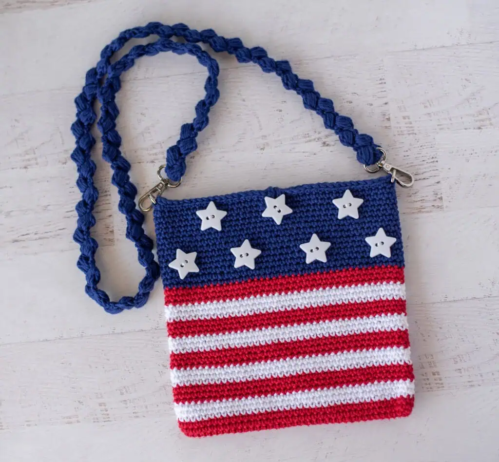 A crocheted purse with stars and stripes.