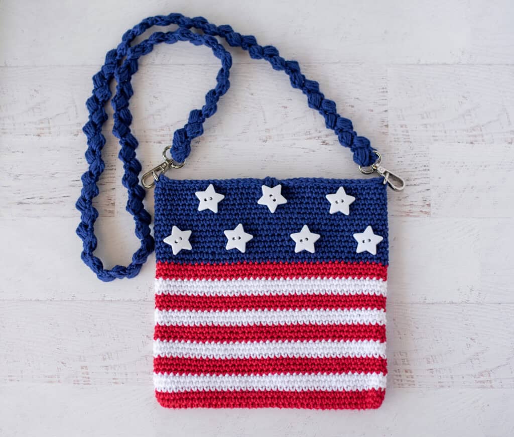 A crocheted purse with stars and stripes.