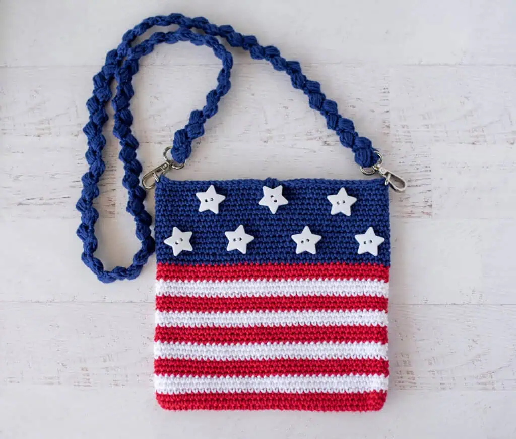 A crocheted purse with stars and stripes.