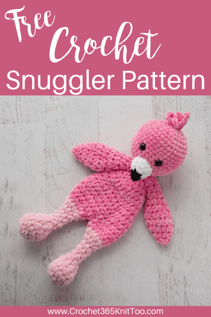Image of a pink crochet flamingo Snuggler