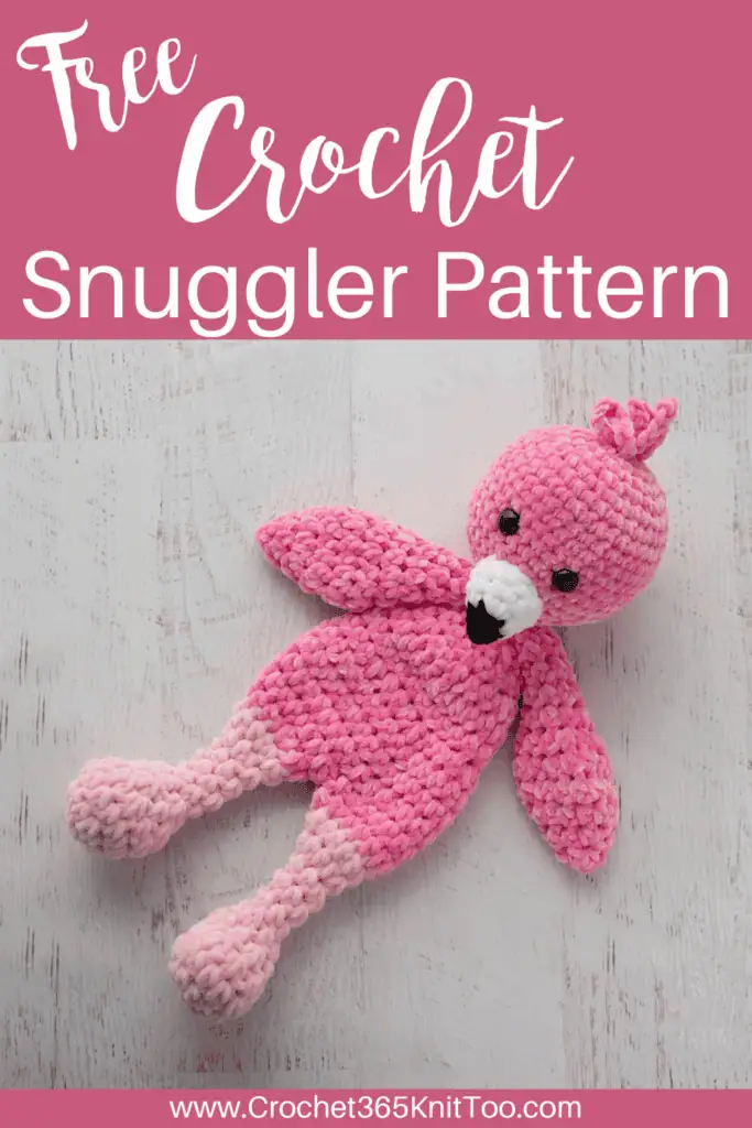 Image of a pink crochet flamingo Snuggler