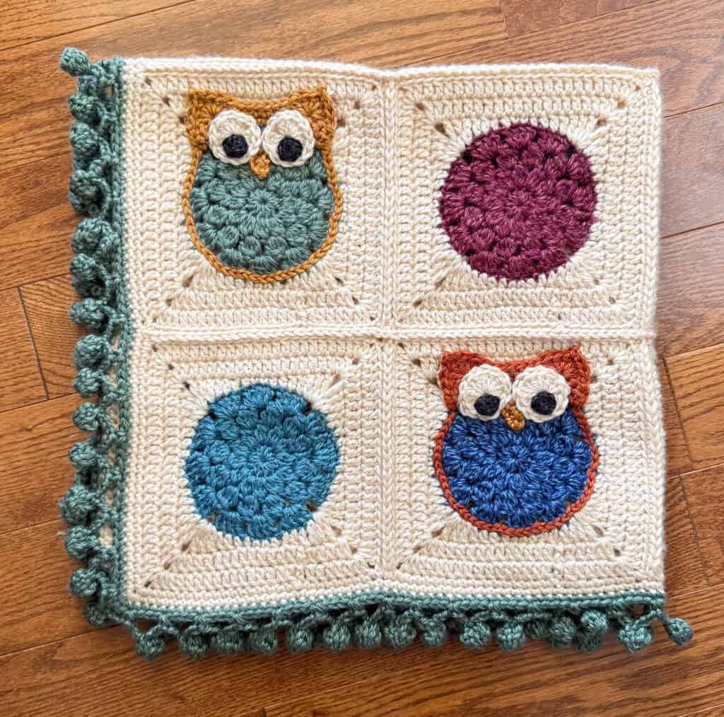 Folded crochet owl afghan blanket