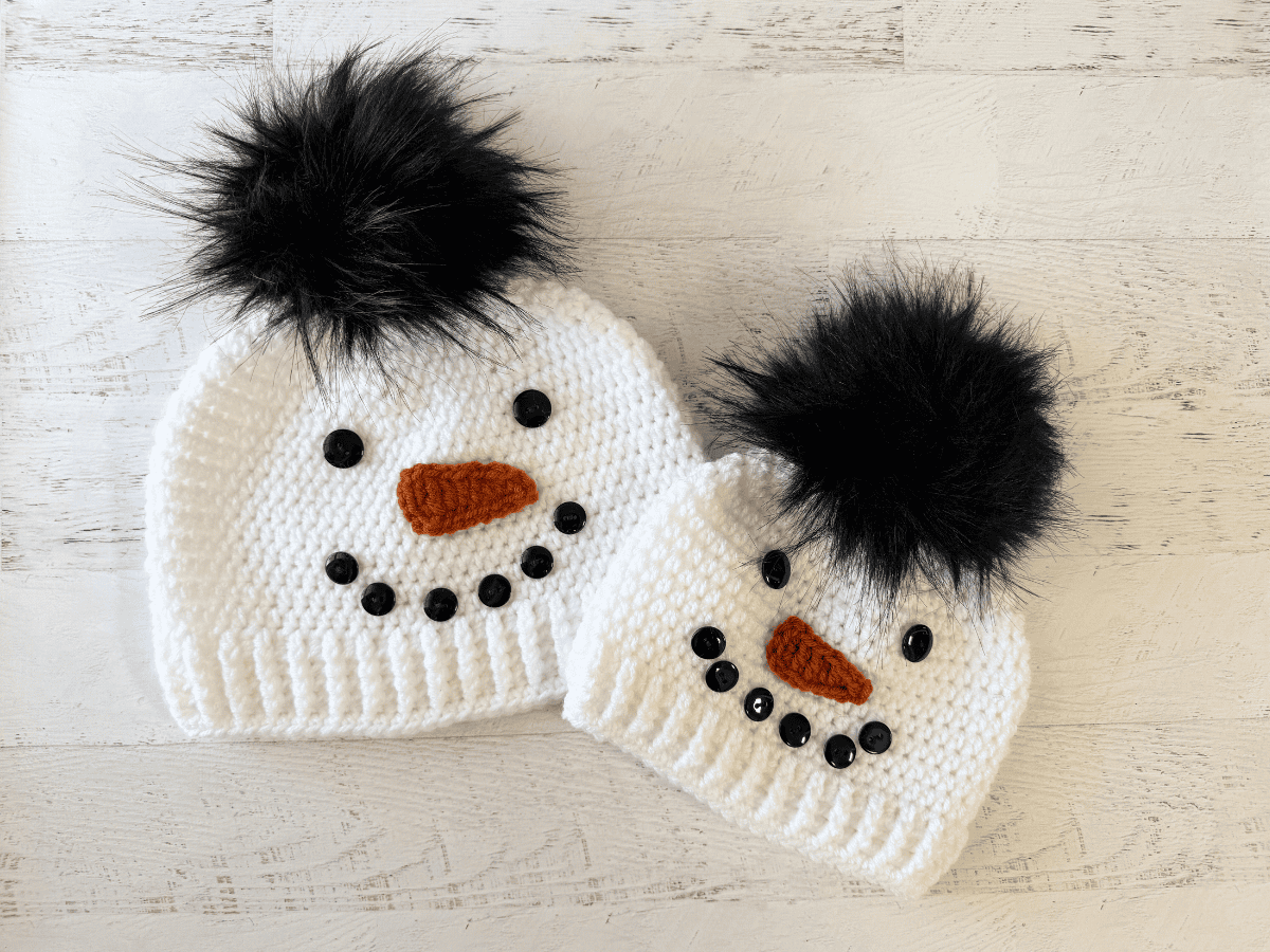Child and adult sized white and black snowman hats.