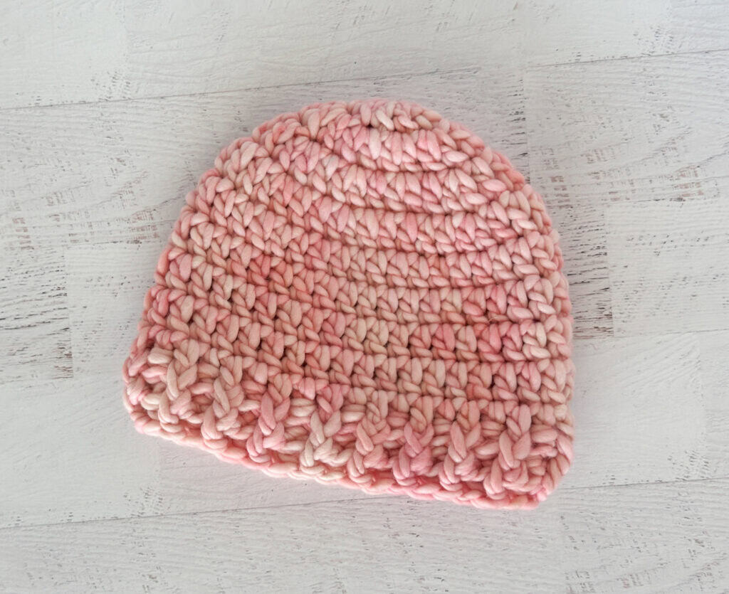 crochet hat in pink yarn