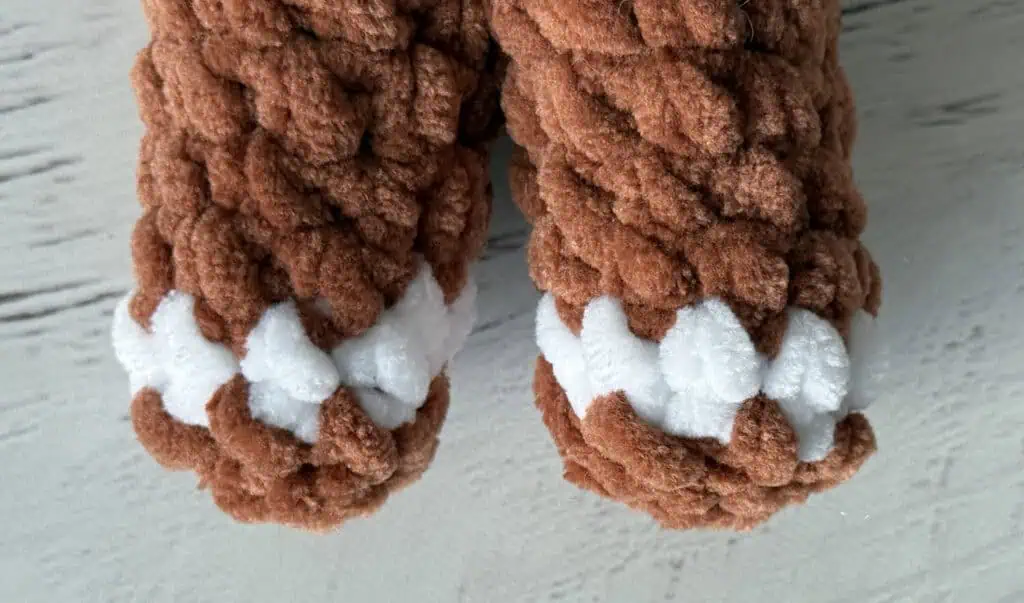 close up of crochet gingerbread man legs