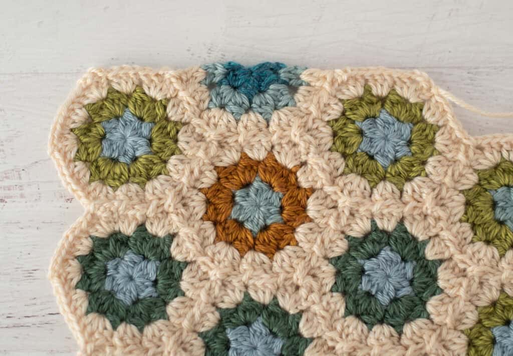 Close-up of crochet granny hexagons made with colorful yarn