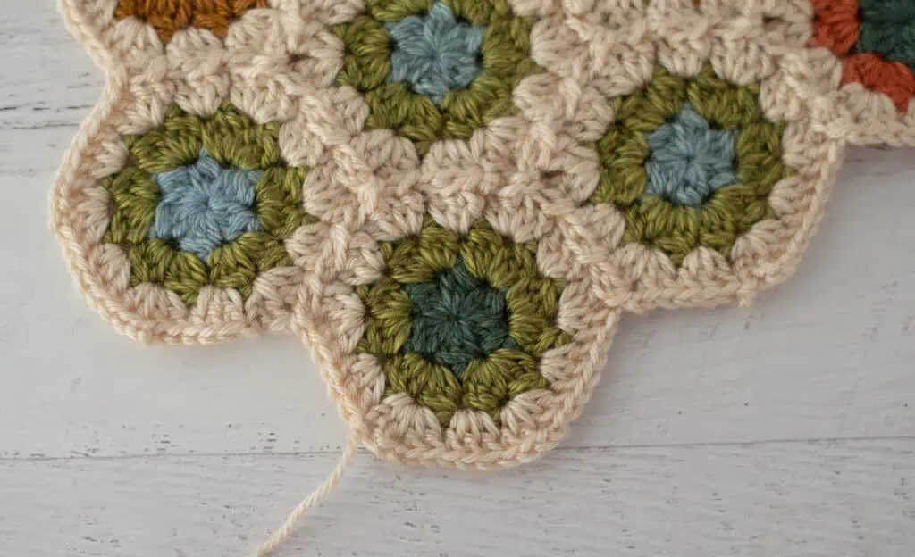 Close-up of crochet granny hexagons made with colorful yarn