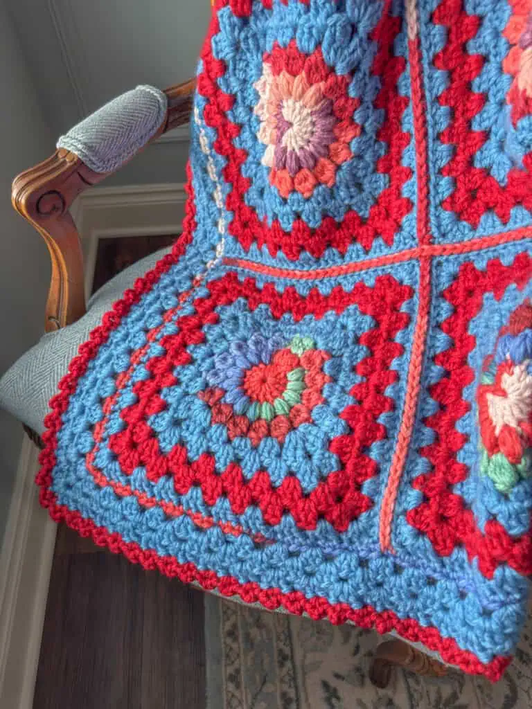 Colorful crochet afghan on a chair