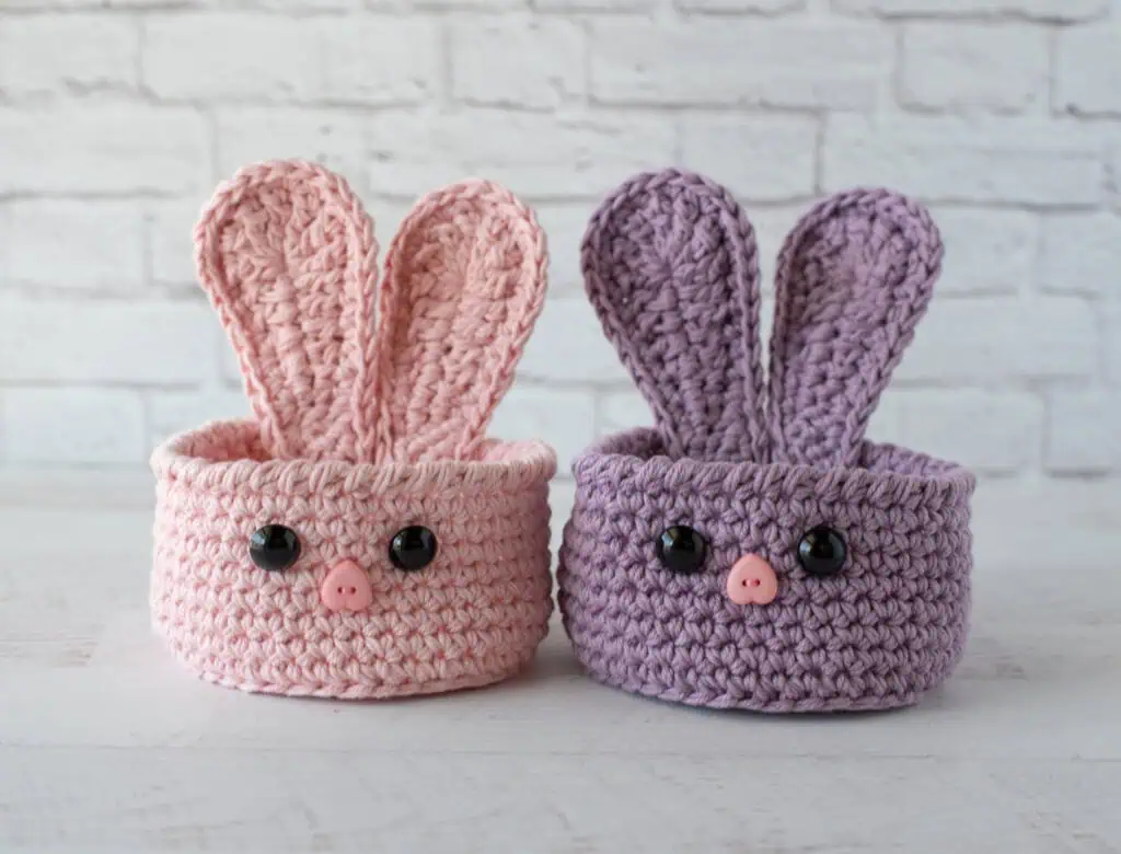 bunny baskets out of pink and purple yarn