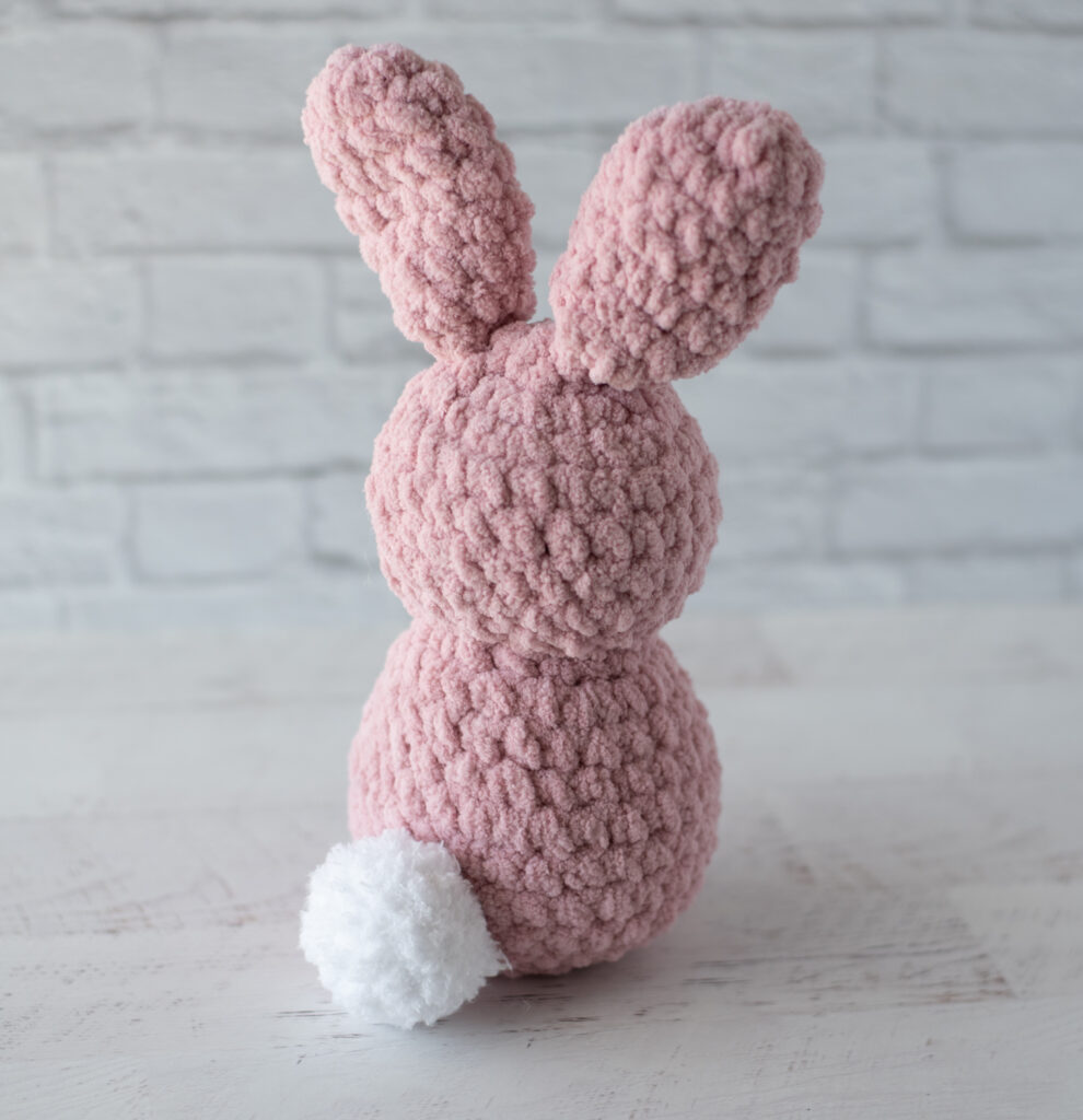 Back of Pink Crochet Bunny with white tail