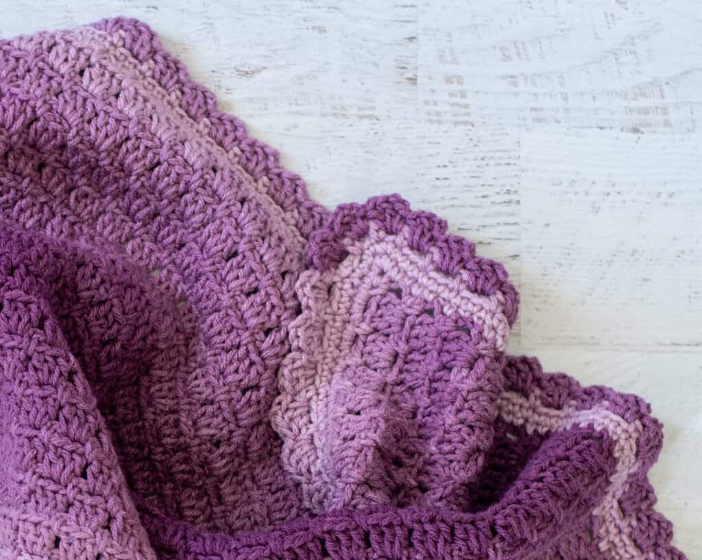 Edging of purple baby afghan