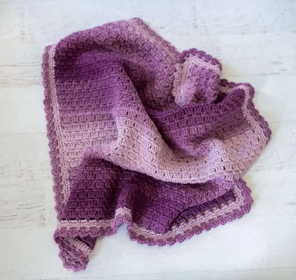 Crochet purple baby afghan scrunched up