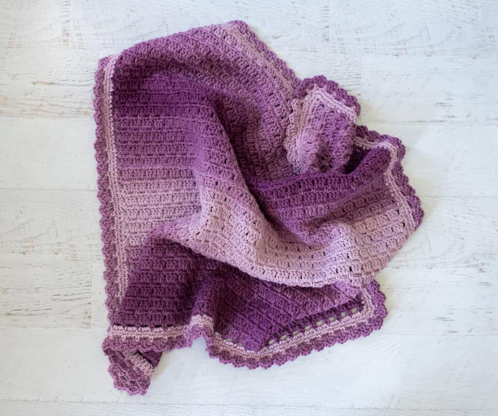 Crochet purple baby afghan scrunched up