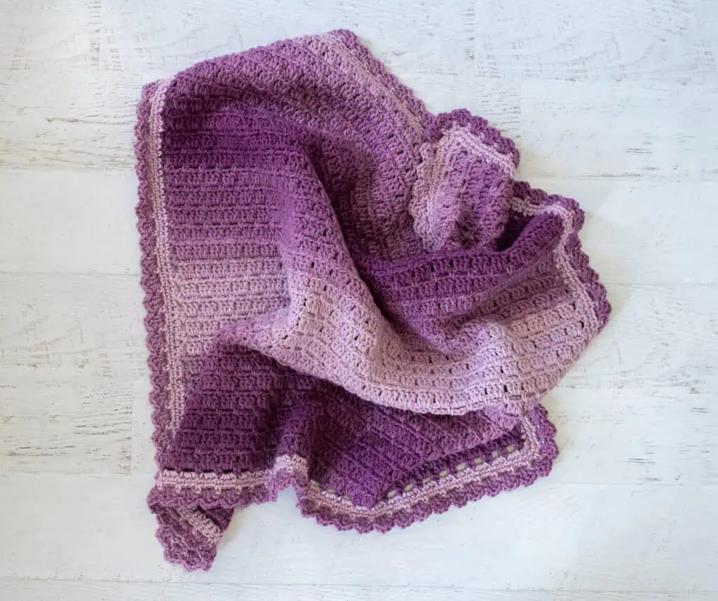 Crochet purple baby afghan scrunched up