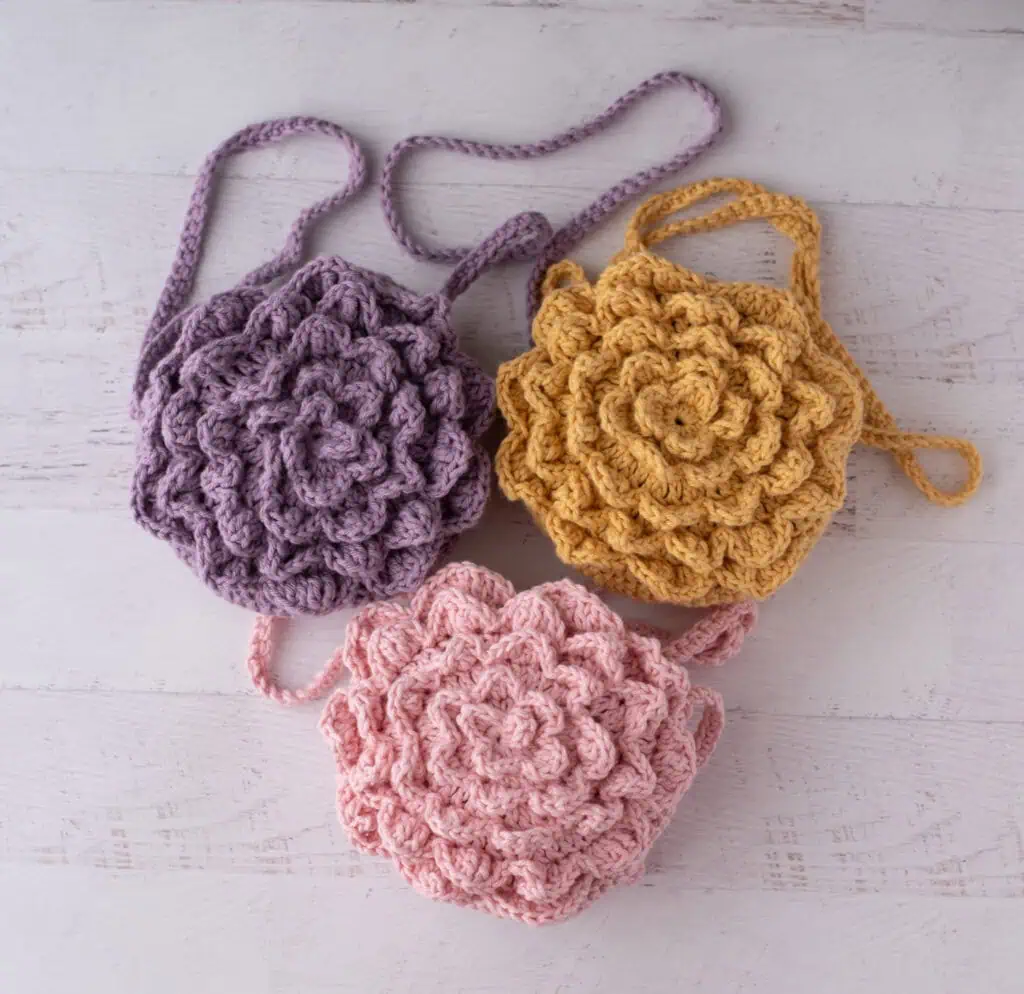 3 flower crochet market bags in pink, purple and yellow