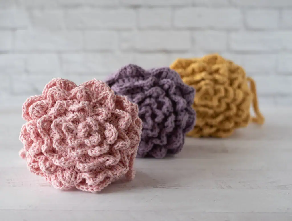 3 flower crochet market bags in pink, purple and yellow